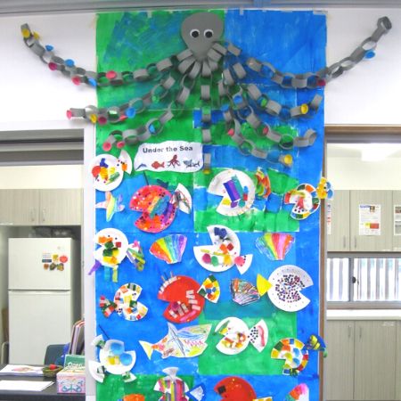 Inside the centre: octopus and marine life craft displayed on the wall