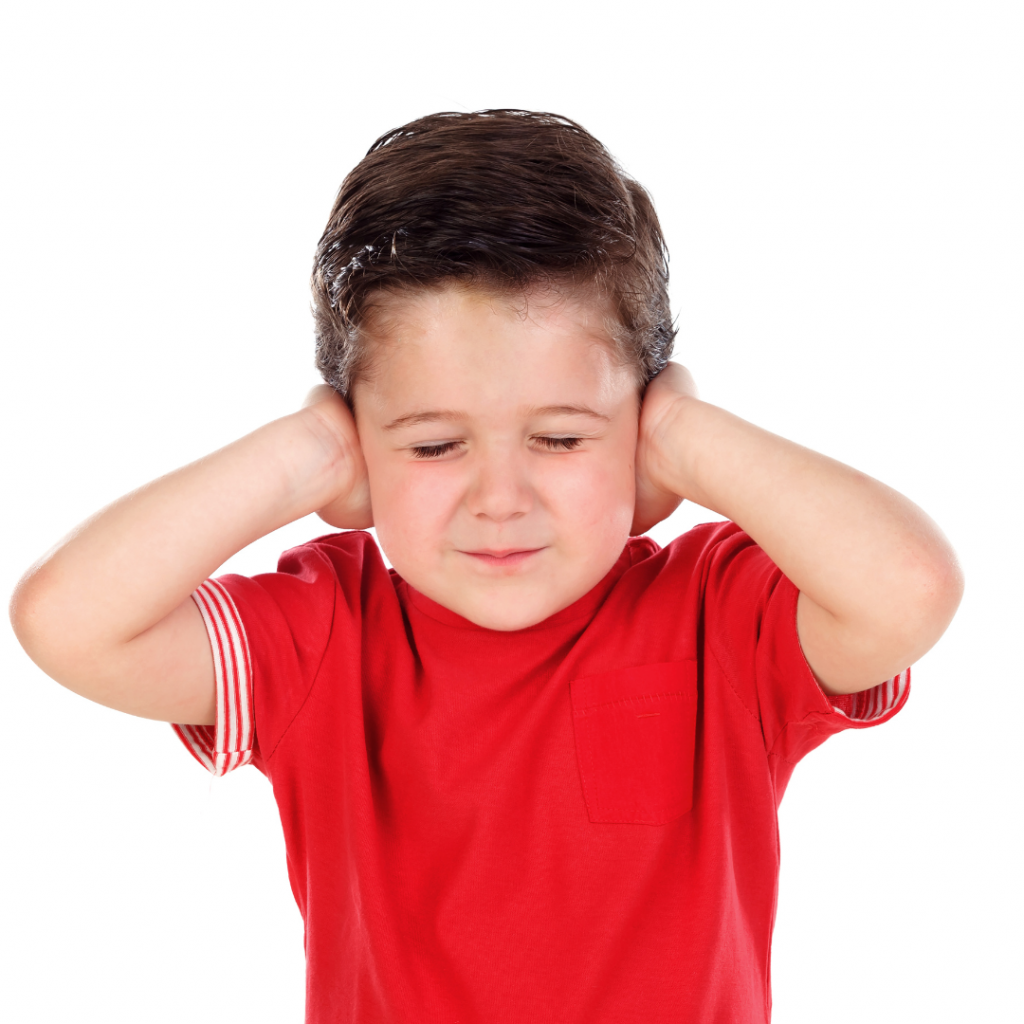 alt="boy with sensory disorder covering his ears"