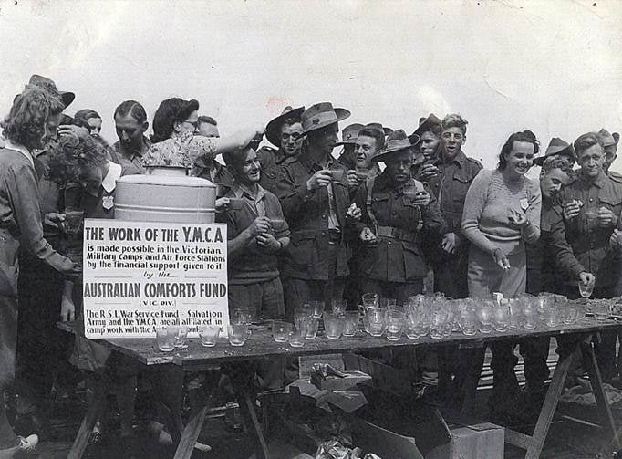 alt="YMCA workers in world war 1, providing food to soldiers"